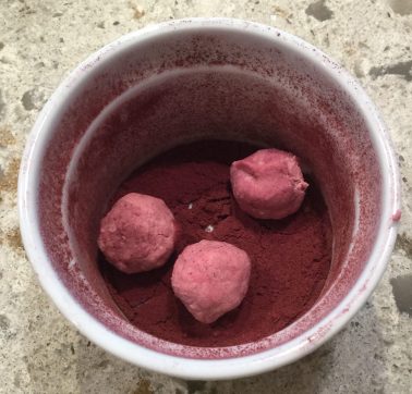 Malvaceae: cocoa truffles rolled in hibiscus powder